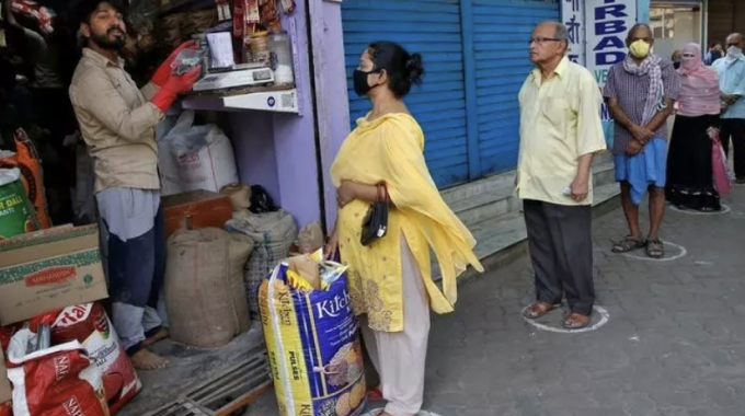 This Delivery Startup Does More Business Than Swiggy & Zomato in His Hometown. Here's How... people waiting outside grocery store